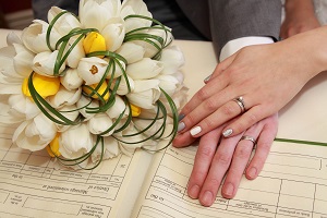 a picture of two hands with tulips flowers